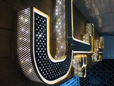 the letters u and j are illuminated in bright lights