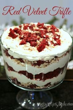 a red velvet trifle cake with white frosting and strawberries on the top