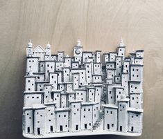 this is an image of a model of a city made out of cardboard and paper