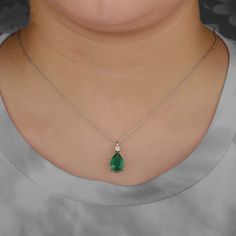 "Genuine 3.00 Ct Pear Shape Emerald Diamond Pendant Necklace Solid 14K Yellow Gold Minimalist Certified Necklace Birthstone Jewelry Gift Idea ≫ Features * Items Code:- SGN00894 * 18K also available - Additional fees may apply) * More options in gold color: Rose, yellow, White gold * Metal: Solid 14K Yellow Gold with stamped * Diamonds Weight: 0.11 Ct * Diamond Color: G-H * Diamond Clarity: SI1 * Diamond Cut: Brilliant (Excellent cut) * Emerald Weight: 3.00 Ct  * Measurement:-   Chain Length:- 16 Emerald Diamond Pendant, Princess Jewelry, Diamond Evil Eye, Necklace Birthstone, Emerald Pendant, Anniversary Jewelry, Rose Yellow, Diamond Pendant Necklace, Delicate Necklace