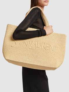 Find SAINT LAURENT Raffia Blend Tote Bag on Editorialist. Item Code:79I-G1N027 Item Color: Naturel Height: 43cm Width: 35cm Depth: 18cm Handle drop: 21cm Double top handles Front logo detail One internal pocket Unlined Composition: 50% Raffia, 50% Viscose Ysl Tote, Purse Ideas, Crochet Purse, Ski Accessories, The Saint, Saint Laurent Bag, Woven Design, Mule Sandals, Crochet Purses