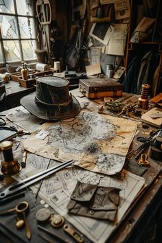 a table topped with lots of different types of tools and paper on top of it