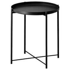 a round black table with metal legs