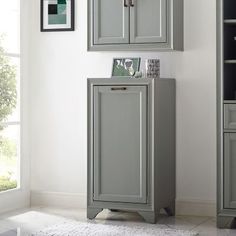 a gray cabinet in the corner of a room