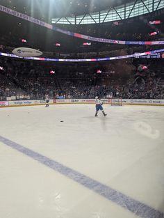 an ice hockey game is being played on the rink