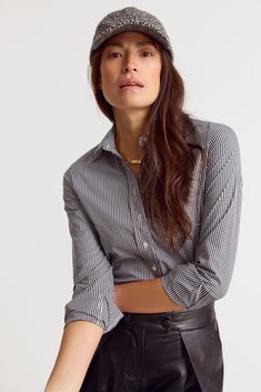 The Icon Shirt runs tailored at the waist, chest and back. For a contemporary fit, order true size. For a blousier fit, size up, or consider The Boyfriend Shirt for an even looser look.

 Meet your new closet staple: the small check shirt, in our perfect-fit cotton stretch. We designed our best-selling Icon Shirt to be fitted throughout, giving you a body-hugging shape yet eliminating blouse gape completely.  Our cotton stretch is sourced near and produced in our factory in Portugal by a local t Slim Fit Button-up Top For Work, Modern Business Casual Top With Spread Collar, Modern Business Casual Button-up Tops, Black Spread Collar Tops For Workwear, Modern Slim Fit Button-up Tops, Casual Slim Fit Tops For Office Wear, Smart Casual Slim Fit Tops For Office, Black Relaxed Fit Blouse For Business Casual, Chic Slim Fit Top With Spread Collar