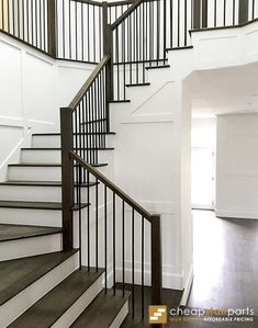 an empty room with stairs leading up to the second floor