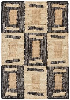 a black and white rug with squares on the bottom, in different shades of brown