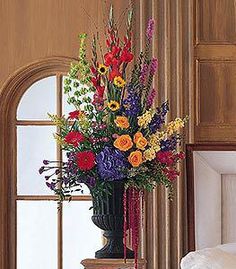 a large vase filled with lots of colorful flowers