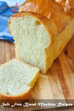 a loaf of bread sitting on top of a wooden cutting board