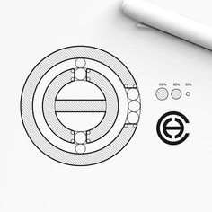 a drawing of a circular object next to a marker