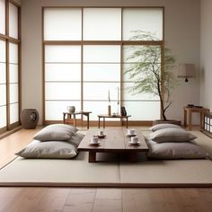 a living room filled with furniture and large windows