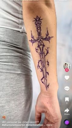 a person with a cross tattoo on their arm