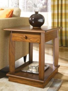 a wooden end table with a vase on top