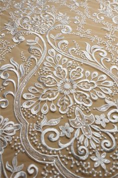 "This stunning Lace Fabric design piece has soft hand feel, It's perfect for weddings, bridal parties, and any events. Shop our large inventory of bridal fabrics. ☆PRODUCT DESCRIPTION : This gorgeous fabric is made on a sheer base with a beautiful vintage embroidery throughout. The fabric width is approximately 51\" (130cm) Wide. Color: off-white or beige as in picture Material: Rayon, Polyester，Sequins ☆ PURCHASING INFORMATION: This fabric is sold by the yard and each Qty you enter will represe Gold Embroidered Lace Fabric For Wedding, Wedding Lace Fabric With Gold Embroidery, Cream Embroidered Fabric For Ceremony, Ceremony Cream Embroidered Fabric, White Wedding Lace For Festive, White Wedding Lace For Festive Occasions, White Wedding Lace, Cream Wedding Fabric With Intricate Embroidery, Wedding Cream Embroidered Fabric With Intricate Details