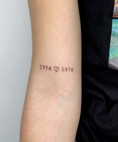 a man with a small tattoo on his arm that says, after all there is love