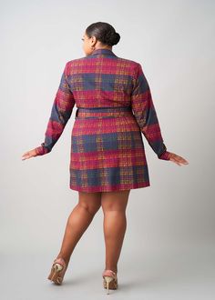 Style#: 2098/ P2098 Meaning elegant, Aniq, this stretch blazer dress with its detachable belt, 2 flap pockets, and polyester satin lining is the showstopping piece of the fall collection. The African-inspired Harvest Plaid Adire print is perfect for the fall season; you'll stand out and fit the aesthetic of autumn. Wear it on its own or pair it with our Talia stretch pants! Features Notch Collar Single Button Closure at Center Waist Slight Flare in the Sleeve Polyester Satin Lining 72% Rayon/ 24 Office Wear Fitted Long Sleeve Belted Dress, Fitted Long Sleeve Belted Dress For Office, Fitted Long Sleeve Belted Office Dress, Fitted Belted Blazer Dress For Fall, Fitted Long Sleeve Belted Dress For Fall, Fitted Belted Dress With Lapel Collar, Fitted Belted Dress For Fall, Fall Mini Length Belted Dress, Fitted Belted Dress For Workwear In Fall