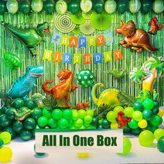 an all in one dinosaur birthday party with balloons and streamers