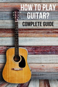 an acoustic guitar with the words how to play guitar? complete guide on top of it