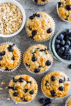 blueberry oatmeal muffins with fresh blueberries in the background