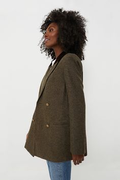 The perfect outfit topper for brisk mornings and in-office days, the Wool Tweed Holland Blazer is elegant yet effortlessly cool. With strong structured shoulders, a chic lapel collar with velvet detailing, and a double-breasted front closure, this classic, boxy-yet-tailored silhouette is a must-have for the season. Pair it with trousers or a mini skirt for an elevated ensemble, or with a crisp white tee and denim for weekend wear! Notched lapels Velvet detail at back of collar Long sleeves with Tweed Blazer With Double-breasted Button And Long Sleeves, Tailored Long Sleeve Tweed Jacket With Double-breasted Buttons, Tailored Long-sleeved Tweed Blazer, Timeless Long-sleeved Tweed Outerwear, Brown Wool Button-up Blazer, Business Casual Outfits For Work, Cocktail Attire, Tweed Fabric, Gold Buttons