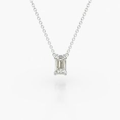 14K White Gold Emerald Cut Diamond Solitaire Pendant (0.25 CTW - H-I / SI1-SI2). This light four prong wire basket is designed to showcase the unique characteristics of an emerald cut diamond. This lovely solitaire pendant is attached to an 18 cable link chain. Truly a classic design that is perfect for any occasion. Silver Emerald Cut Diamond Necklace With Single Cut Diamonds, Silver Diamond Necklace With Emerald Cut Single Diamonds, White Gold Solitaire Necklace With Emerald Cut, White Gold Emerald Cut Solitaire Necklace, Classic Solitaire Necklace With Baguette Cut In Diamond White, Classic Solitaire Necklace With Emerald Cut Diamonds, Classic Solitaire Baguette Cut Necklace In Diamond White, Classic Emerald Cut White Diamond Necklace, Classic White Emerald Cut Diamond Necklace