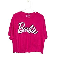 a pink shirt with the word barbie on it