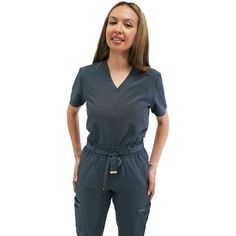 Fubu Scrubs are fashion-forward and performance driven. A brand with a fashion legacy and a highly distinctive identity, they will meet the demands for stylish, yet functional medical garments. Fubu Scrubs are redefining industry standards and empowering healthcare professionals to express their individuality with confidence. Size: S.  Color: Gray.  Gender: female.  Age Group: adult. Nurse Uniform, Womens Scrubs, Scrub Tops, Healthcare Professionals, Scrubs, Fashion Forward, Medical, V Neck, Grey