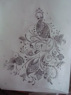 a piece of paper that has been drawn with ink and some flowers on it,