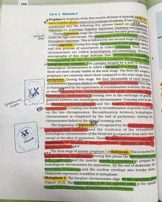 an open book with several different colored lines on the page and some words written in it