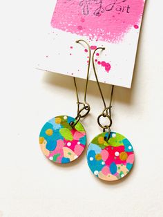 Art adorns your home and spaces but have you ever wanted to wear art in a fun, unique way? I've created these mixed media earrings with you in mind! Trendy hand painted earrings are ready to help you make a statement! Did I mention that they're double sided, too? The front side features a bold, abstract painting with gold shimmery accents and the back is complete with a fun pattern painted in white. Very light weight and easy to wear! What they're made with: - light weight wooden disc - acrylic Fun Earrings Diy, Abstract Painting With Gold, Jewellery Painting, Painted Wooden Jewelry, Painting With Gold, Abstract Ideas, Joy Art, Hand Painted Earrings, Polymer Clay Diy