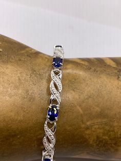 This is a lovely blue iolite with white diamond accent bracelet in 925 sterling silver Approximately 7 length, tab closure East Village Bangles is the product of love ❤️, a unique collection of vintage jewelry painstakingly restored by Casey in the East Village. Even as we put love, sweat (and sometimes tears!) into restoring these items, it is our policy that you must be thrilled. We stand behind every item and we will take it back if it is not for you. Elegant Blue Sterling Silver Bracelet As Gift, Elegant Blue Sterling Silver Bracelet For Gift, Formal Sterling Silver Bracelets With Gemstone Accents, Elegant Sapphire Sterling Silver Bracelet As Gift, Blue Sterling Silver Tennis Bracelet For Anniversary, Sterling Silver Bracelets With Gemstone Accents For Anniversary, Blue Sterling Silver Bracelet For Anniversary, Sapphire Tennis Bracelet With Diamond Accents As Gift, Sapphire Gemstone Diamond Bracelet For Anniversary