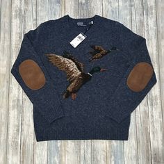 This Polo Ralph Lauren sweater in size medium is perfect for casual or business occasions. The tight-knit wool fabric in solid blue color features a crew neck and long sleeves, with a pullover style. The sweater has a hunting theme with a duck design, making it suitable for hunting season as well. The sweater is brand new with tags and has not been previously owned or worn. Duck Sweater, Knit Duck, Hunting Fashion, Deer Sweater, Sloane Ranger, Hunting Style, Lumberjack Style, Hunting Theme, Academia Aesthetic Outfit