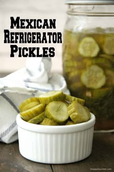 mexican refrigerator pickles in a white bowl on a wooden table next to a mason jar