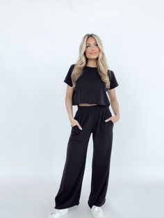 Indulge in comfort and style with our Tranquility Sweatpants. These high-waisted pants feature a stretchy elastic waistband, pocket details, and a wide leg for a flattering fit. Made with a soft and knit material, these pants are perfect for lounging or running errands in the spring and summer seasons. With raw hem detailing and a versatile design, these pants are a basic essential for any wardrobe. Self 65% Polyester 35% Cotton Hand wash cold. Knitting Materials, Summer Season, Pocket Detail, High Waisted Pants, Running Errands, Jumpsuit Romper, Wide Leg, Sweatpants, Hand Wash