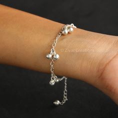 "Very beautiful and cute piece. The bells make sweet jingling sound and is my personal best. In fact, I made one for myself for the love of it. Must have this unique bracelet in your daily wear daily wear collection.  Bracelet made of silver chain and silver bells. for any changes please message me.  Length is 6.5 and has adjustable rings too. You can find a similar \"ghungroo\" or charms necklace at-  https://www.etsy.com/in-en/listing/660481137/925-silver-ghungroo-mangalsutra-indian" Sterling Silver Adjustable Charm Bracelet, Sterling Silver Beaded Dangle Bracelets Gift, Adjustable Sterling Silver Charm Bracelets, Adjustable Sterling Silver Dangle Beaded Bracelets, Silver Beads Dangle Bracelet For Gift, Dainty Sterling Silver Charm Bracelet In Silver, Sterling Silver Dangle Beaded Bracelets For Jewelry Making, Silver Beaded Bracelets As Gift For Her, Silver Sterling Silver Charm Bracelet As Gift For Her