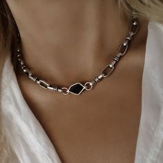 PRODUCT DESCRIPTION Unique silver link chain choker with asymmetric onyx black color pendant. The necklace has a sophisticated modern look, yet with a boho touch! If you want to make your outfit look amazing and with a presence, don't miss the necklace on your neck! MEASUREMENT AND SIZE ✦The total length of the necklace is 15 (39cm). Choose your necklace length from the drop-down menu. Material: ✦This necklace is made from 925 silver-plated brass - high scale quality, GIFT WRAPPED: Every order i Silver Necklace Choker, Alternative Silver Jewelry, Chunky Silver Choker, Black Chain Link Edgy Jewelry, Edgy Black Chain Link Jewelry, Modern Black Metal Choker, Trendy Black Necklace With Silver Chain, Black Metal Link Necklace, Edgy Black Jewelry With Chunky Chain