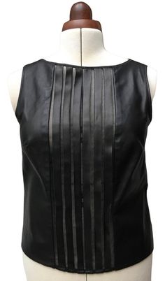 "A luxe top, made with leather and silk organza. Small medium size  Black leather strips sewn onto silk organza at centre front, then leather either side The back is sheer silk organza with button placket and  sleeves in leather trim Shiny black, edge faceted buttons to do up Bias leather trim to neckline and armholes Pretty amazing top. CONDITION  Very good condition. Does have a perfume smell to it. LABELS  \"USA 8  Can 8  UK 10  Italy 40  France 38\" \"Danier\" \"Genuine Danier\" \" Professional Leather Clean\" \" Made in Canada\"  \"CA02558  RN97205\" \"Danier Leather Outer shell leather\" \" Organza fabric 100% Silk/Soie.  Exclusive of trimming\" Make sure you hang leather with adequate airflow. Allows leather to breathe, and helps prevent mould growth. MEASUREMENTS  Bust-91.5-94cm/36 Silk Shell Top, Elegant Sleeveless Organza Top, Fitted Organza Tops For Evening, Elegant Leather Tops For Night Out, Elegant Leather Formal Tops, Elegant Leather Tops For Formal Occasions, Elegant Leather Party Tops, Elegant Formal Leather Tops, Silk Tops Blouses