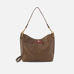 This bag pairs style and function effortlessly, converting from a shoulder bag to crossbody for two looks in one. Pier Shoulder Bag In Pebbled Leather  Dark Elm SHOULDER in Dark Elm | Hobo® Leather Shoulder Bag With Gold-tone Hardware For On-the-go, Pebbled Leather Crossbody Shoulder Bag For On-the-go, Chic Textured Leather Hobo Bag For On-the-go, Double Handle Pebbled Leather Shoulder Bag For On-the-go, Versatile Textured Leather Top Handle Shoulder Bag, Textured Leather Hobo Shoulder Bag For Work, Versatile Leather Hobo Bag In Satchel Shape, Versatile Leather Hobo Bag Shaped As Satchel, Versatile Leather Hobo Bag With Double Handle