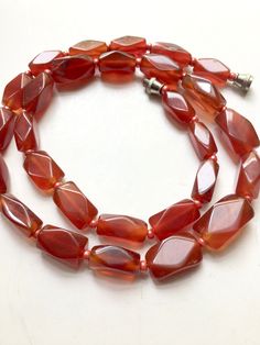 Natural red carnelian stone necklace deep even color 11 x 6 mm hexagon rectangular stones, 18inches long, barrel clasp, carnelian is represented as the stone of courage & endurance Luxury Single Strand Carnelian Beaded Necklace, Red Carnelian Necklace With Faceted Beads, Red Faceted Beads Necklaces For Healing, Red Carnelian Jewelry With Faceted Beads, Red Faceted Carnelian Necklaces, Red Faceted Carnelian Jewelry, Symbol Of Courage, Metaphysical Jewelry, Red Carnelian