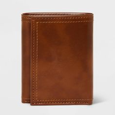 Comfortably carry your cards and money with this Trifold Wallet from Goodfellow & Co™. This tri-fold wallet features multiple card slots, ID pocket and a bill compartment, while the tri-fold design lends it a non-bulky feel, making it easier to slip in the front or rear pockets of your trousers. Best of all, it features RFID blocking that helps prevent your cards and IDs from digital theft. Showcasing a faux-leather finish in brown, it's sure to bring classic style to your everyday accessories. Cheap Brown Trifold Wallet For Personal Use, Cheap Brown Trifold Wallet For Daily Use, Trifold Wallet With Card Slots, Brown Trifold Wallet For Daily Use, Brown Trifold Card Holder, Brown Trifold Wallet With Coin Pocket, Brown Trifold Wallet With Rfid Blocking, Classic Brown Trifold Wallet, Brown Trifold Wallet With Card Slots