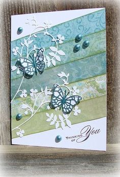 a close up of a card with butterflies on it