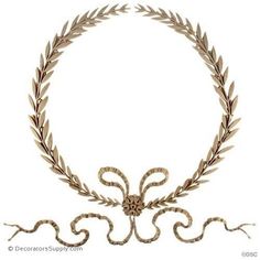 an image of a wreath made out of wood and metal with two snakes on each side