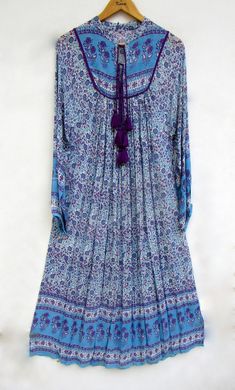 "ITEM DESCRIPTION rayon blue purple printed maxi dress - collared neckline with tassel summer maxi dress - long sleeve boho maxi dress Features: Long sleeve, collared neck, Long dress Material: rayon crepe Fabric: 100% rayon soft light weight ethnic print fabrics  Sleeve Length = 22 inch For more sizes & their measurement, please refer our below chart to understand the sizes variations available with us For your size requirement, please mention your size in seller note at the time of buying. SIZ Long Sleeve Boho Maxi Dress, Maxi Dress Long Sleeve, Hippie Look, Ethnic Print, Maxi Robes, Long Summer Dresses, Boho Maxi, Boho Maxi Dress, Crepe Fabric