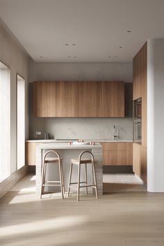 two stools are in front of the kitchen counter and bar area, which is surrounded by wood paneling