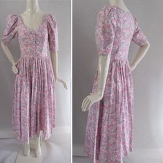 Laura Ashley vintage 1980s pretty fine cotton floral day dress. Lovely light liberty style cotton button bodice dress. pink with white and lilac flower print side zip full skirt half sleeves pockets size 10 measures across shoulders-14in pit-pit-16in across waist-14in nape-waist-14in waist-hem-34in condition Excellent no issues Feminine Cotton Prairie Dress For Spring, Pink Fitted Prairie Dress For Spring, Pink Prairie Dress For Daywear In Spring, Short Sleeve Prairie Dress With Floral Print For Daywear, Floral Print Short Sleeve Prairie Dress For Daywear, Short Sleeve Floral Print Prairie Dress For Daywear, Pink Prairie Dress For Spring Daywear, Cotton Prairie Dress With Floral Print For Daywear, Feminine Fitted Cotton Prairie Dress