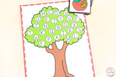 an apple tree with words that spell out the word family on it next to two matching cards