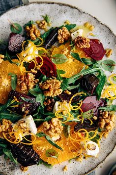 a white plate topped with lots of food on top of a table