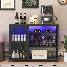 a bar cart with bottles and glasses on it next to a potted plant in the corner