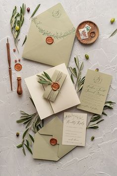 the wedding stationery is laid out and ready to be put into their guests'envelopes